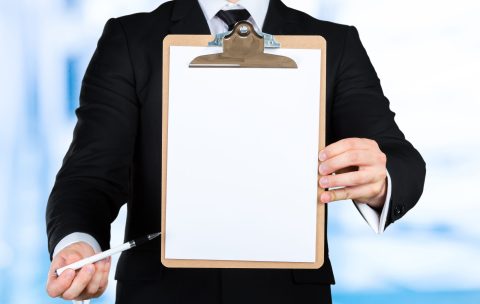 Businessman holding a clipboard
