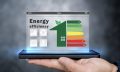 Energy efficiency concept. Person holding energy efficiency rati